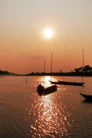 Sunset over water, India